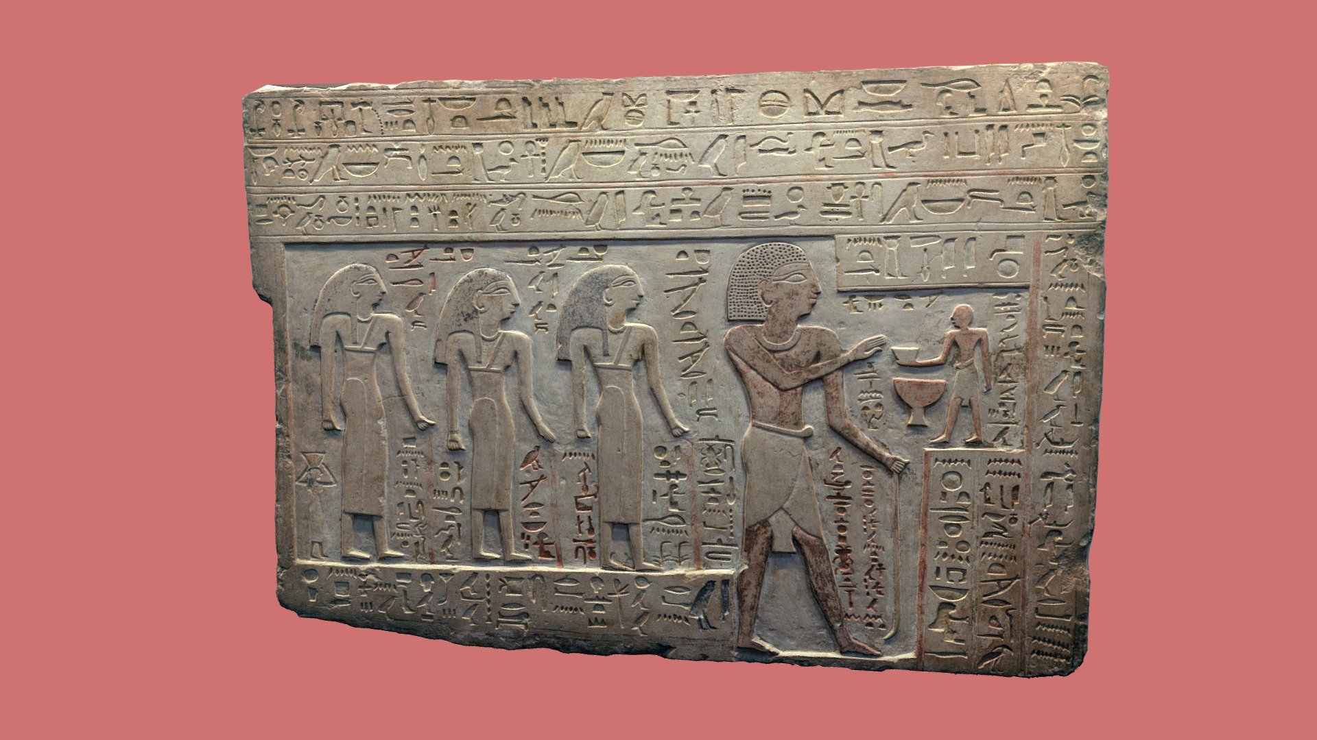 Limestone stela of Intef, son of Ka: Intef is shown standing, receiving an offering from a small male figure who stands in front of him; the positioning of this figure and the scale are very characteristic of the First Intermediate Period. Behind Intef are three female figures, all referred to as his wives, named Mery, Iutu, and Iru. The principal text of the stela, which runs horizontally at the top and then continues vertically at the right side and then in front of the lower parts of the principal figures, is a mixture of offering formulas, important historical information, and phrases that form parts of standard idealized biographical texts.

EA1203 - Stela of Intef - Download Free 3D model by danielpett 3d model