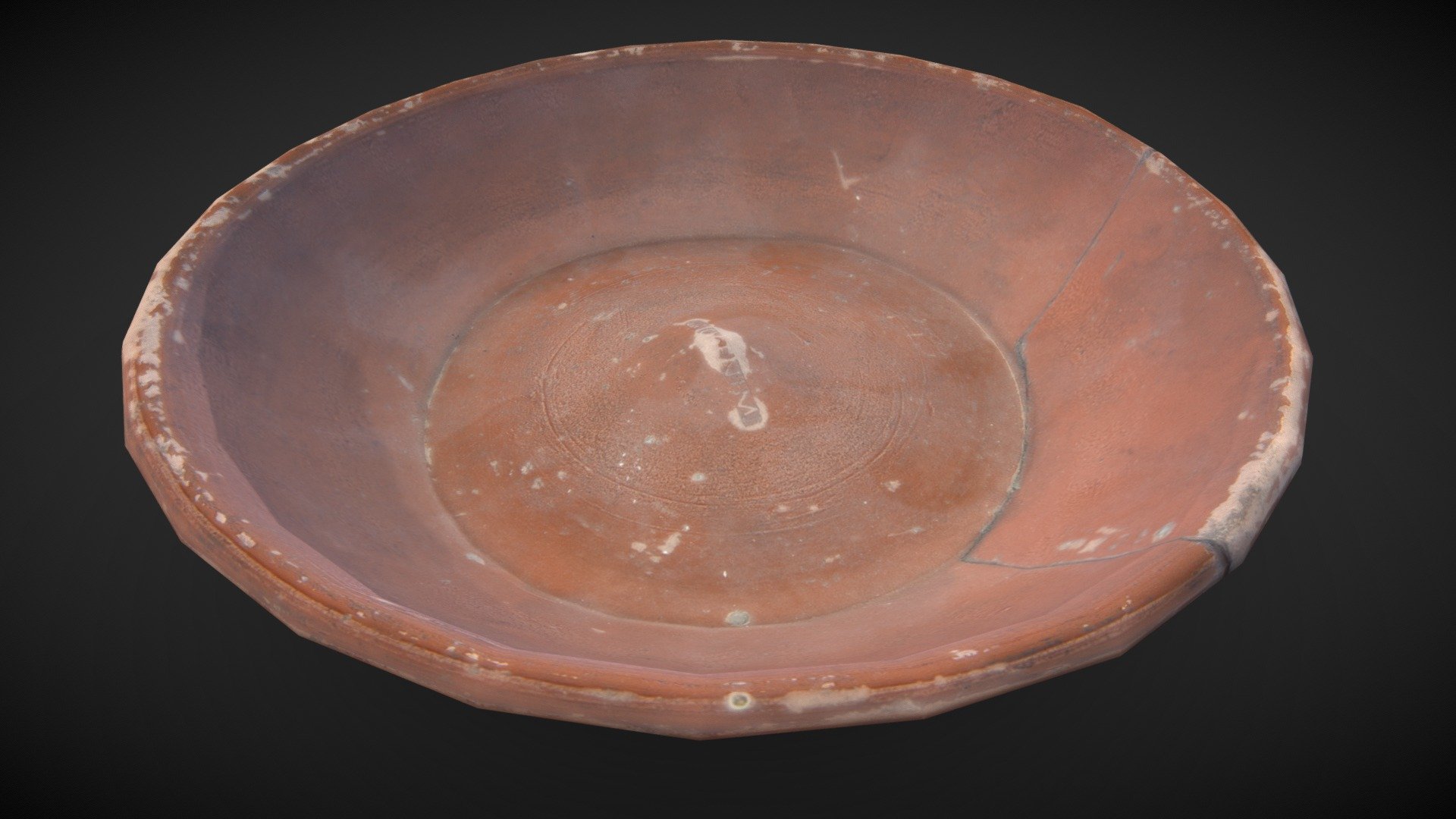 A Samian ware platter from Falkirk, possibly associated with Camelon fort. It is 5cm high and 18cm in diameter. It was made near Lezoux in France and the maker's mark ' RIIOGENIM &lsquo;, which translates as ‘Ritogenus’, is stamped on the inside of the base. 

Fine dishes such as these would have been used by the Roman officers and their families stationed in the forts along the Antonine Wall.

The Antonine Wall stretched right across Scotland, from the Clyde to the Forth. Constructed around 142 AD, and occupied for only 20 years, the remains of its ramparts, steep ditches, forts and bathhouses are still visible today. Since 2008, it has been part of the Frontiers of the Roman Empire World Heritage Site.

More information on the World Heritage Site is available on www.antoninewall.org

Reference: F.1912.1

Hunterian Museum, Glasgow - Samian ware platter, Falkirk, Antonine Wall - 3D model by Historic Environment Scotland (@HistoricEnvironmentScotland) 3d model