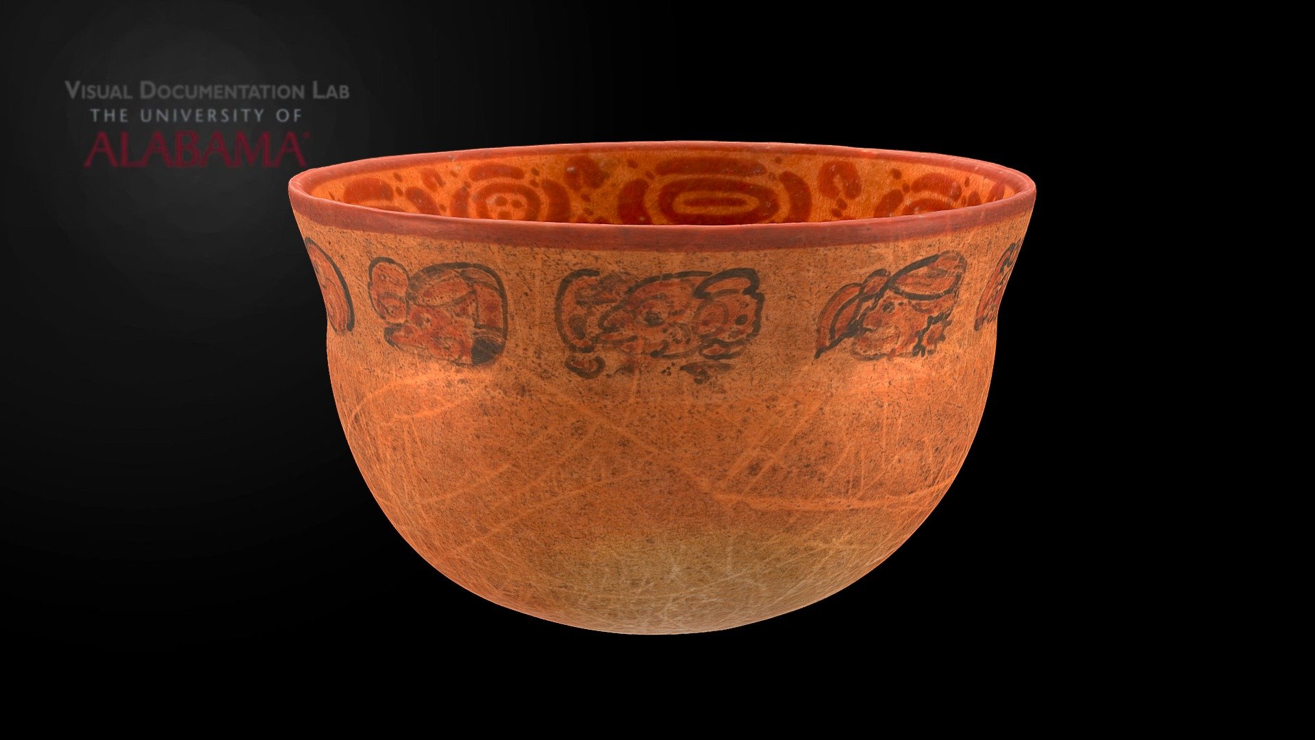 This exquisite drinking cup for atol in the collection of the Snite Museum of Art at the University of Notre Dame (cat. # 1982.053) is adorned along the rim with jaguar prints on the inside and hieroglyphs on the outside. The previously unpublished inscription is one of the finest examples of seventh-century Maya caligraphy and contains rare variants of number 9 and TZ'AK. There are no personal names or place names. The text only states that the cup belonged to &ldquo;the artisan of the eternal lord