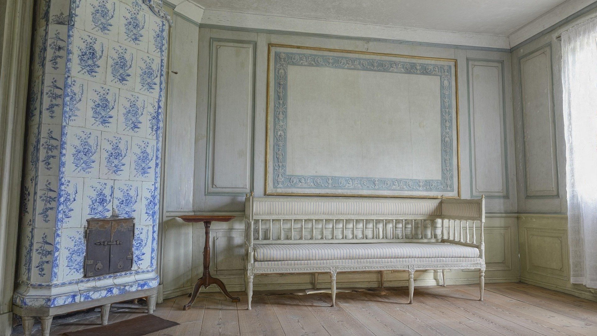 In the eastern part of the mansion to the left there is a guest room, the blue bedchamber, furnished and decorated in Gustavian style. The wall covering, an oil-painted tapestry from the 1790s, is a simplified variant of the wallpaper in the atrium on the other side of the hall. The bed with Sina hangings of mosquito nets, the dressing table covered with white cotton cloth, the veneered desk and the seating furniture signed by Stockholm chairmaker Erik Ohrmark are all good representatives of the Gustavian style. Per Hilleström’s oil painting, dated 1775, gives an idea of how the ladies of the time were dressed. The blade-decorated tile stove originates from a Stockholm house. 

This model is produced by Virtualsweden AB for Skansen - The blue bed-chamber, Skogaholm Manor - 3D model by Virtualsweden 3d model