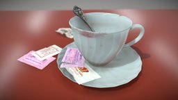 Coffee Cup with Sweeteners and Souvenir Spoon
