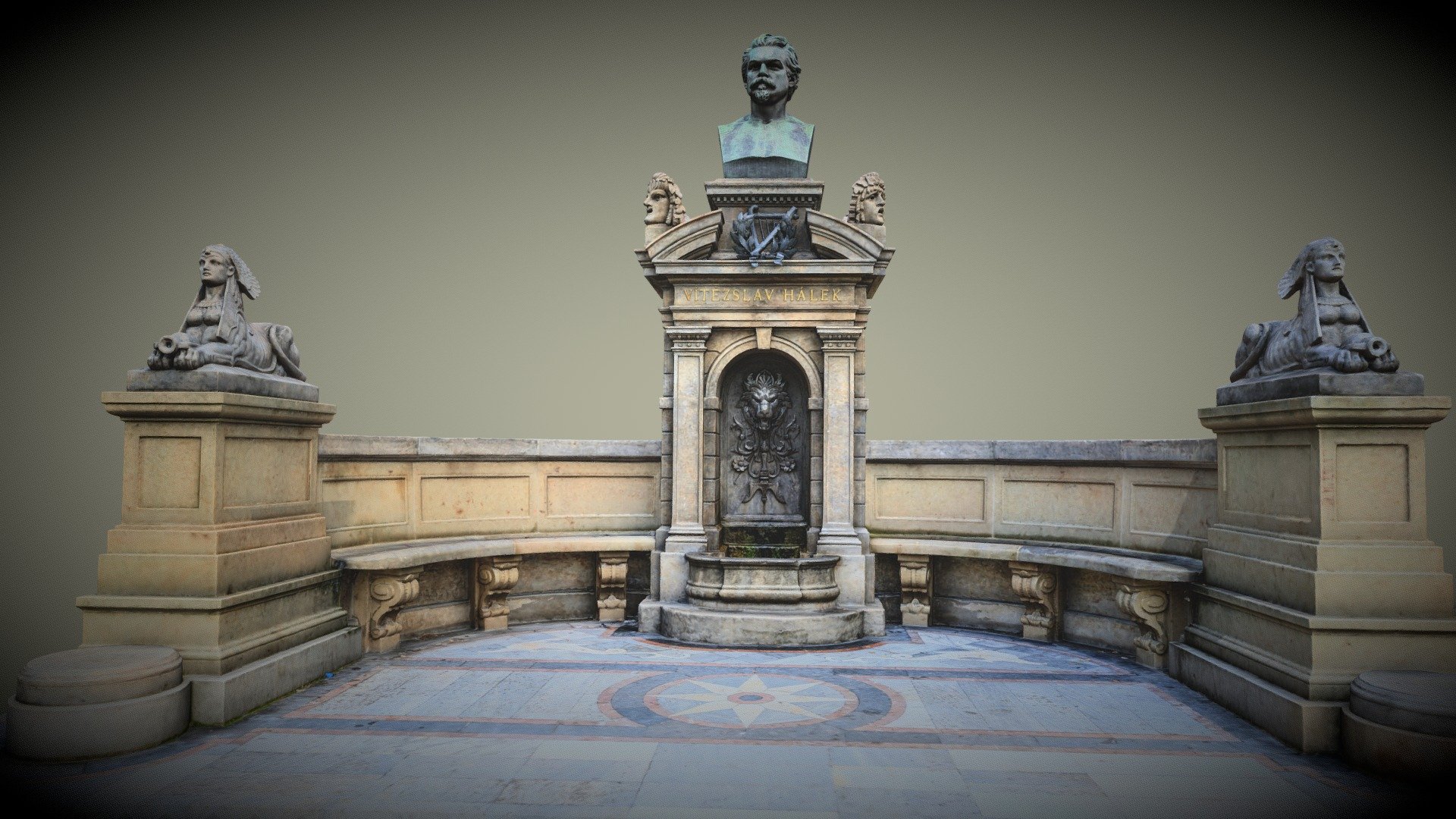 Vítězslav Hájek, is considered the founder of modern Czech poetry.

The ceremonial unveiling of the Hálek Memorial took place on 14 May 1882. The poet's bronze bust is placed above the fountain with a lion's head like a gargoyle. On the lyre below the bust there is a laurel wreath, on the sides are allegories of Comedy and Tragedy . The sides are decorated with a fountain decorated with sphinxes.
The sculptor Bohuslav Schnirch (1845–1901).
Photogrammetry scan 3d model