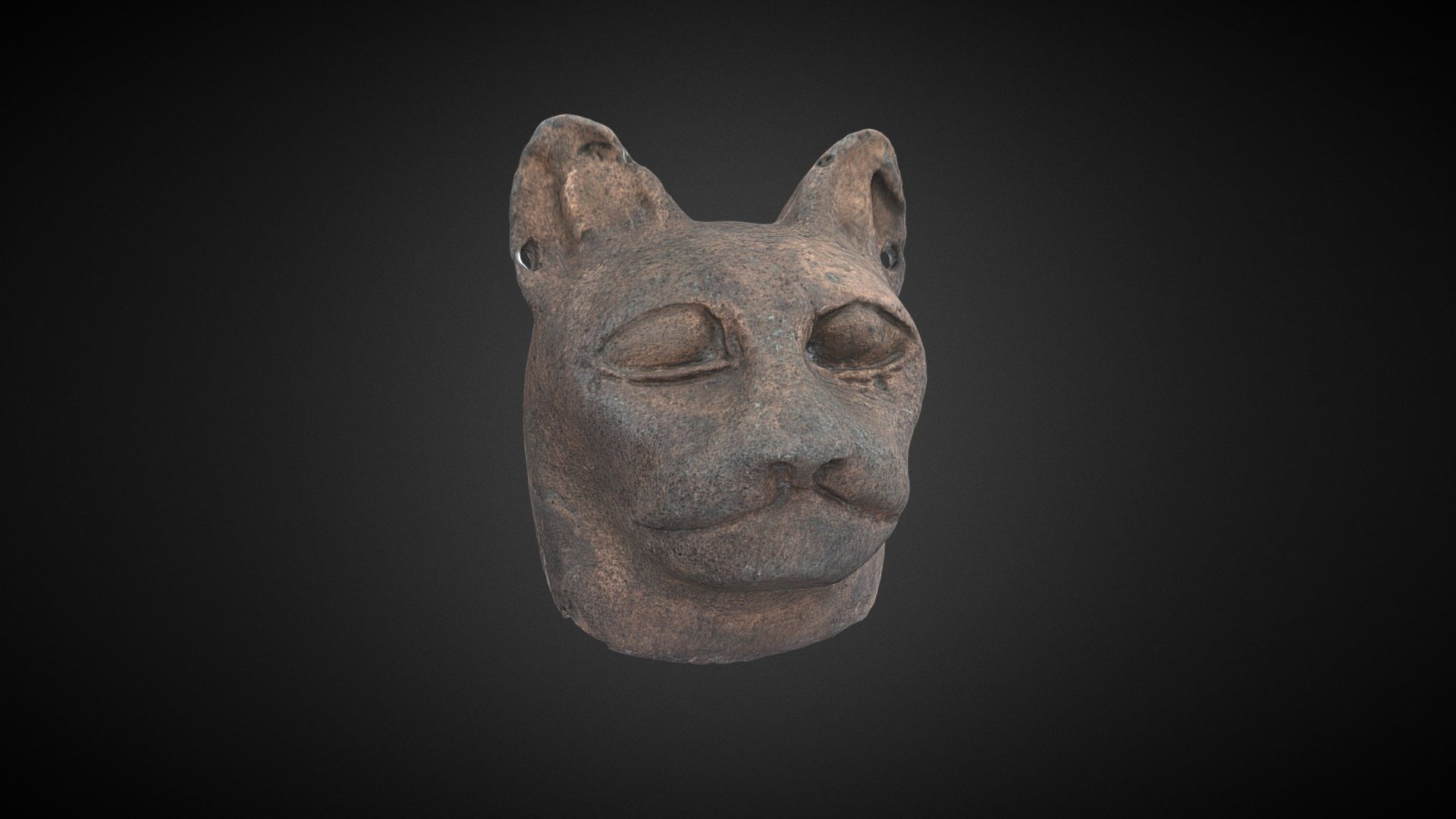 A small ancient Egyptian cat head made of a copper alloy from the collection of Bolton Library and Museum Services. The head is unprovenanced, but these objects are particularly well-attested at the sites of Bubastis and Saqqara. In ancient Egypt, the cat was associated with the goddess Bastet, and many objects like this were created to be given in offering at temples and necropoli. 

This cat head features pierced ears and finely detailed eyes which may have held some form of inlay.

Accession Number: BOLMG:1969.8.A, Bolton Library and Museum Services

Photography and Model Credit: Ian Trumble, Bolton Library and Museum Services

Texture Refinement: Charlotte Sargent

Produced as part of a training workshop for Museums of the North West Photogrammetry Hub: Building Virtual 3D Futures. Learn more here 3d model