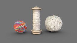 Spool of string and balls of yarn