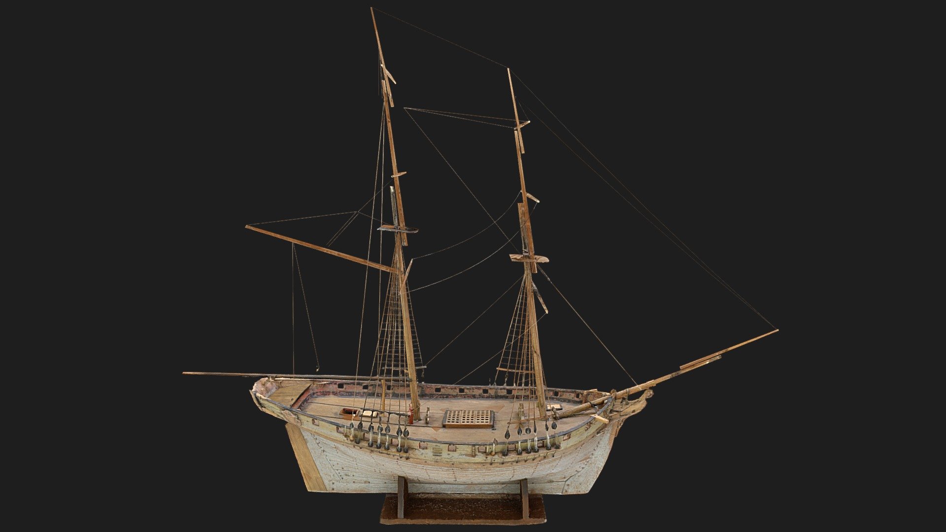 The model has had several parts removed and paint stripped back during an historic attempt at restoration, which has frustrated specific identification. Some elements are suggestive of a Mediaeval cog, especially hull dimensions, keel design and clinker build. Another comparison would be a mid-to-late-18th-century or early 19th-century merchant, or naval, brig. Brigs were two-masted, square-rigged ships which normally had a spanker sail set on the lower mainmast. The foremast was the shorter of the two masts. They were used as both naval and merchant vessels. If this ship is based on a naval vessel it would be classed as a sixth-rate (having 20-28 guns on a single deck) as there are 22 gun-ports.      



This model was brought to you with help from Museums Galleries Scotland as part of the ‘Exploring the Ship Model Collection at the McManus’ project 3d model