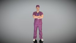 Male doctor standing with crossed arms 424