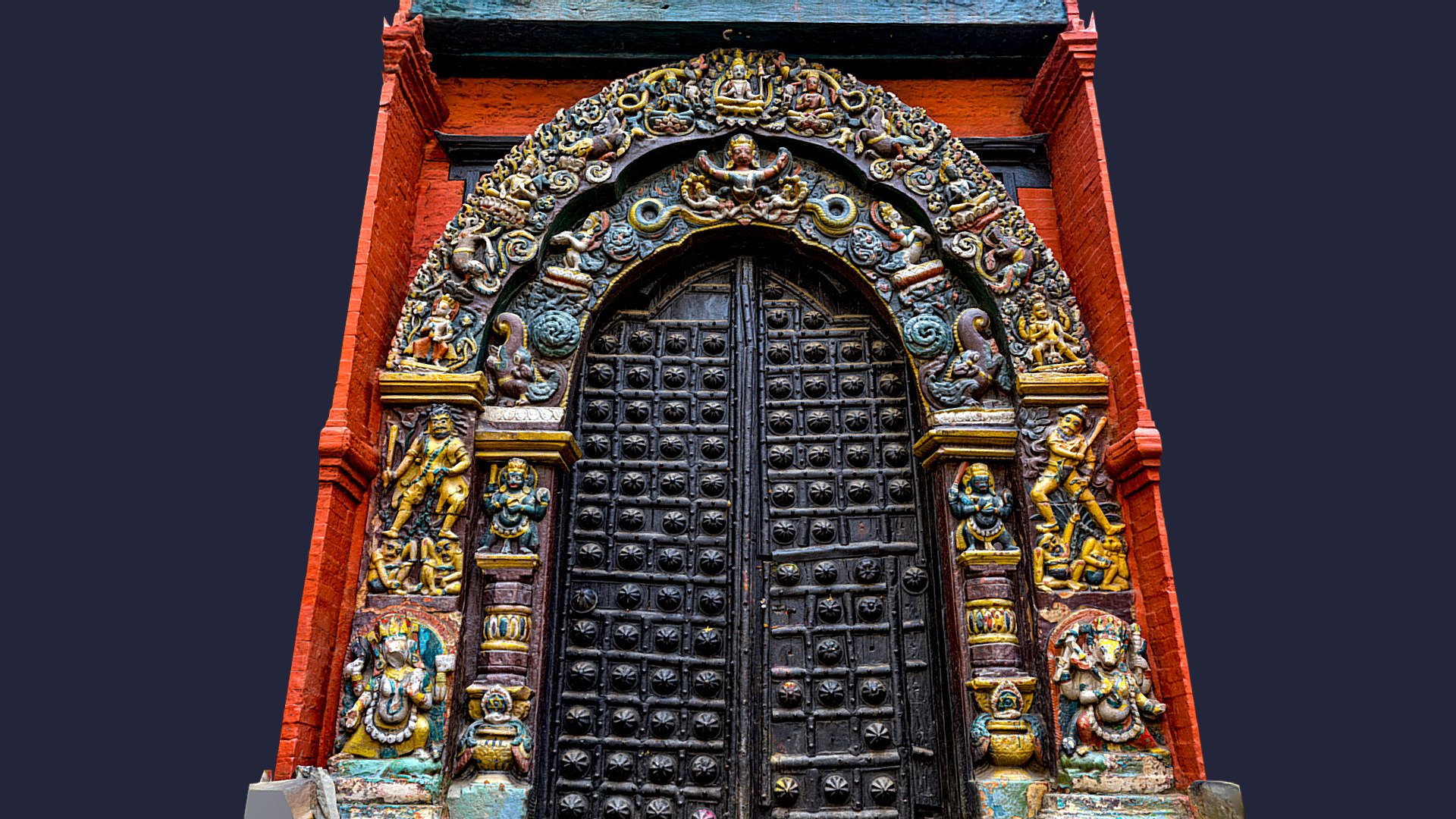 Main entrance gate to Taleju Temple in Hanuman Dhoka inside Kathmandu durbar square.

This temple together with the door, was built in 1564 AD by Mahendra Malla. This temple is one of the holiest temple in Nepal as this temple or this big door is opened only once a year in the festival of dashain. 

Every year in the festival of dashain, a mass killing of animals takes place here as a belief that sacrificing animals pleases &ldquo;Durga
