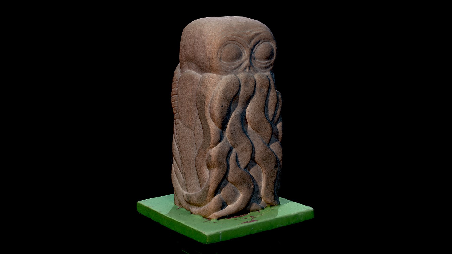 Stone bas-relief sculpture inspired by ones mentioned in H. P. Lovecraft's  lauded tale ‘The Call of Cthulhu’.  Carved out of a block of Dumfrieshire red sandstone by the North England artist  J. M. Mylotte and sits on a green painted wooden pedestal. Photogrammetric rendering was processed in AutoDesk's Remake 3d model
